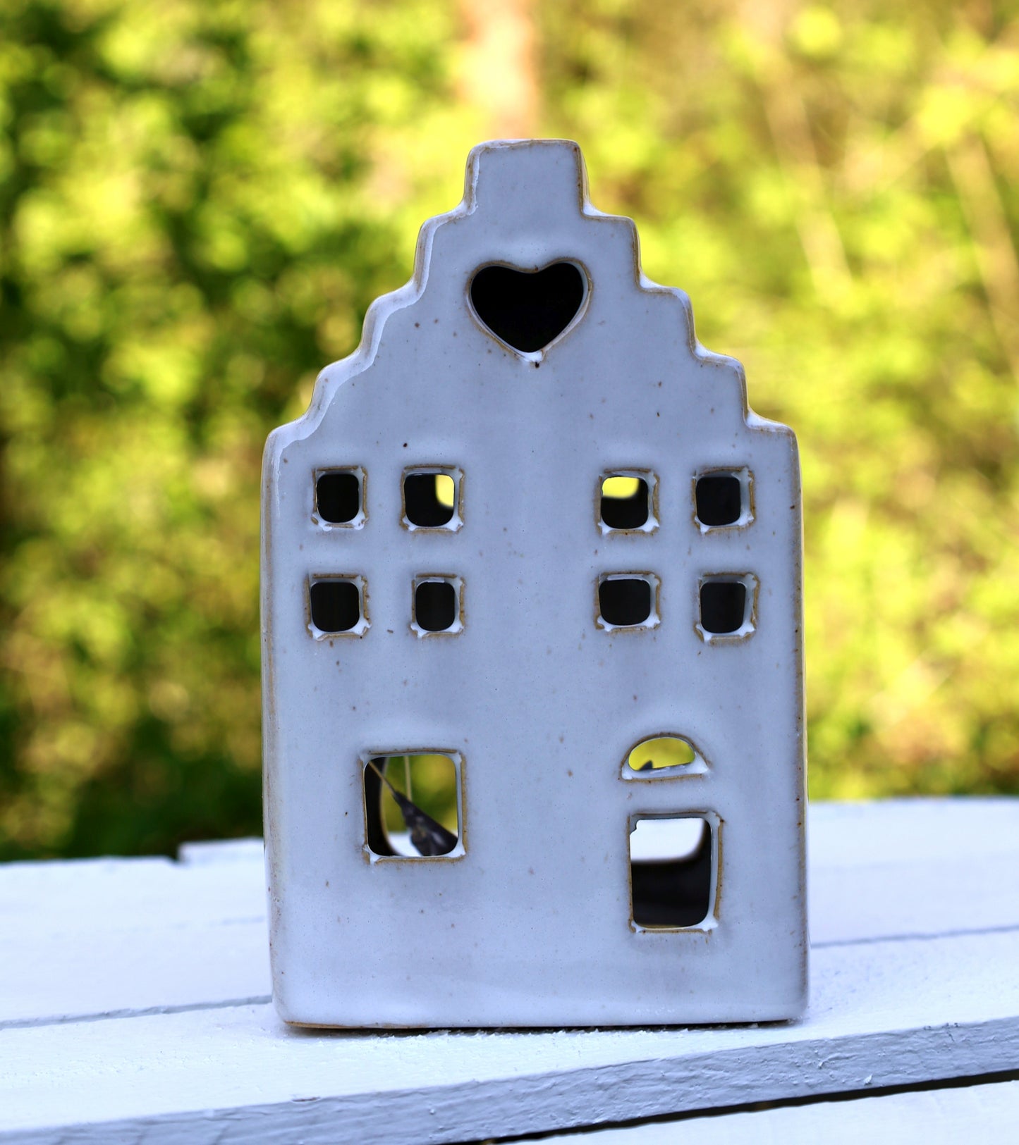 Ceramic tealight holder in the shape of a house